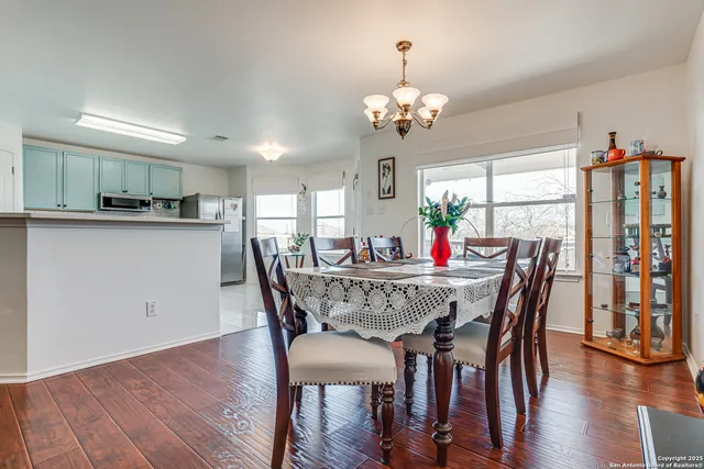 a kitchen with kitchen island white cabinets appliances and sink
