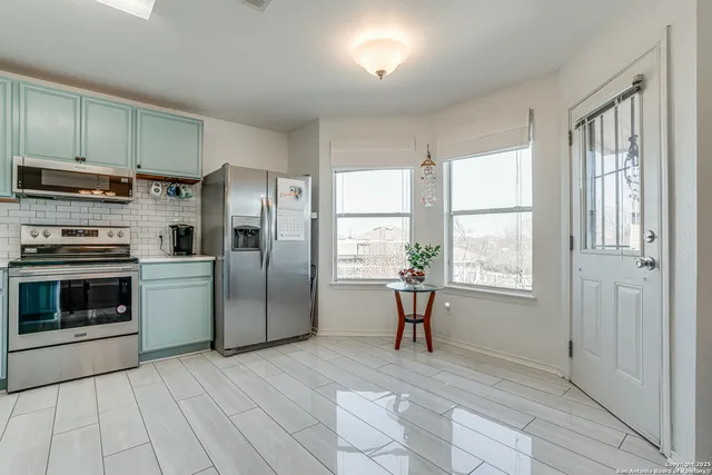 a view of a kitchen and dining room