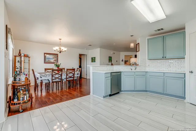 a view of a kitchen and dining room