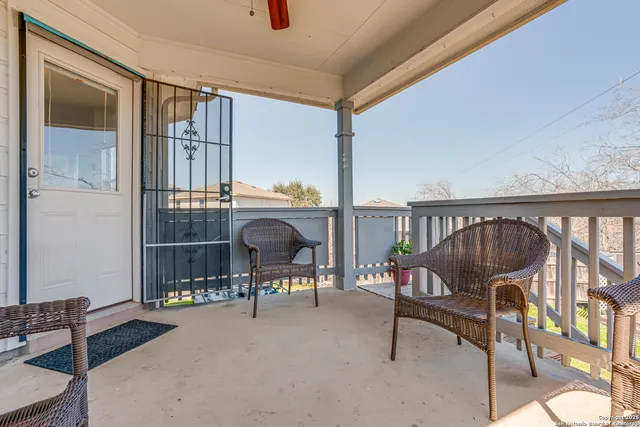 a view of a house with pool and chairs