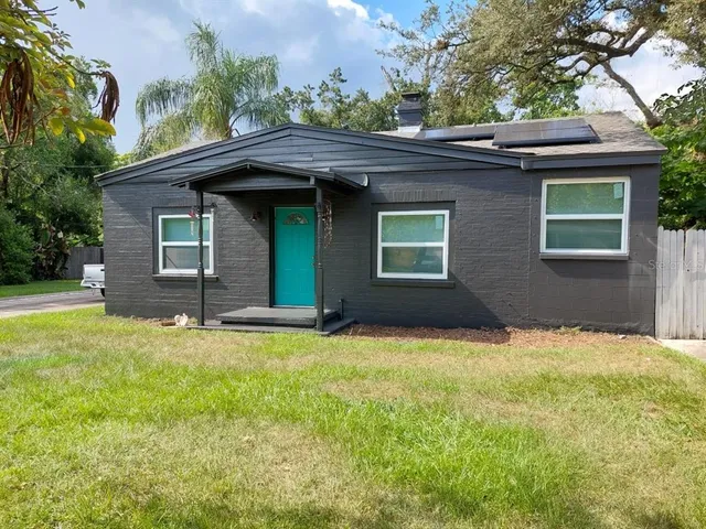 a house with yard in front of it