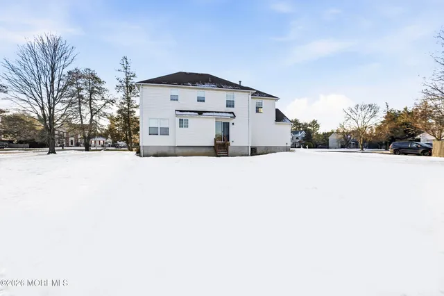 a view of a house with a snow in the yard