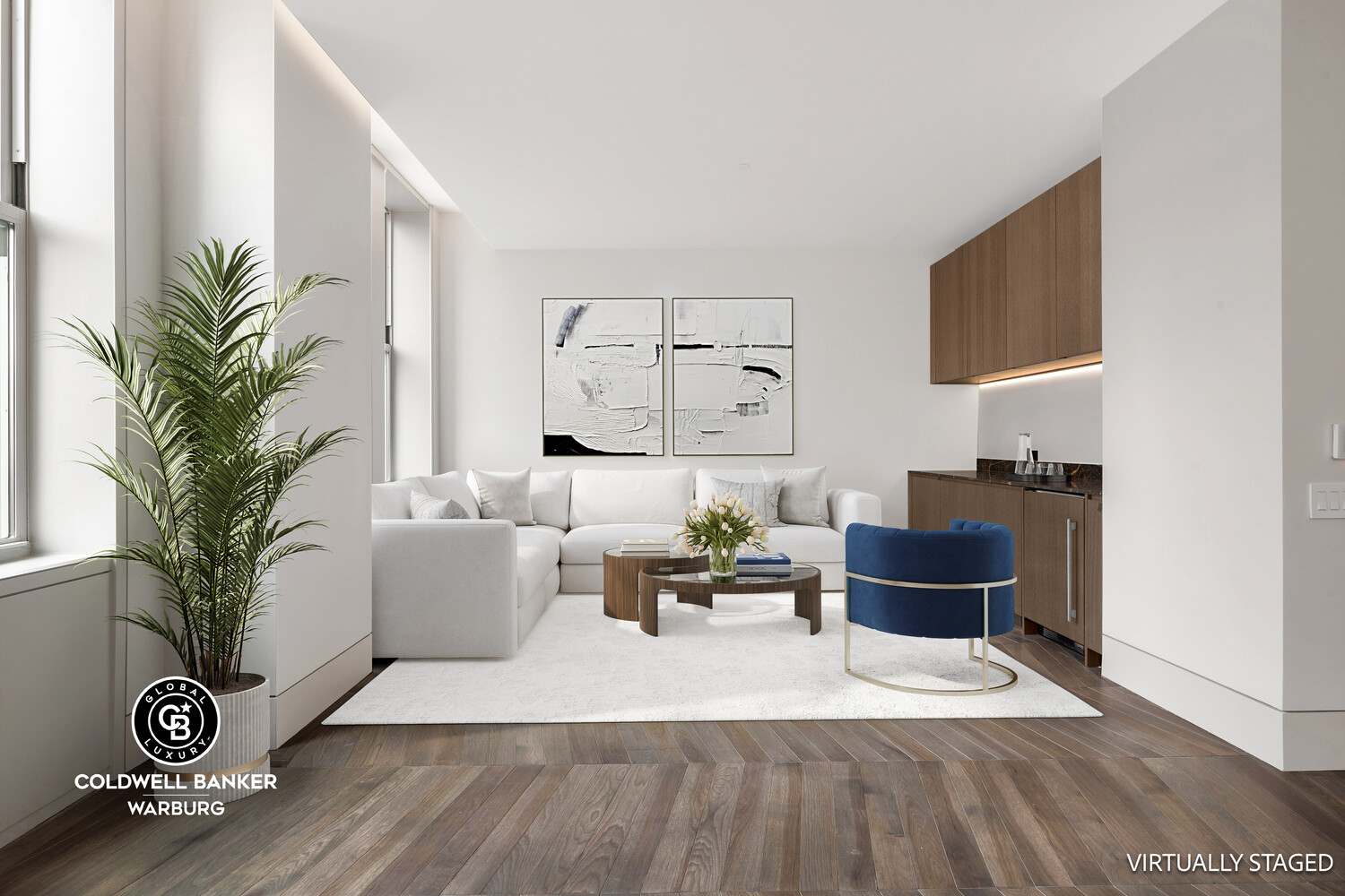 a living room with furniture and a potted plant