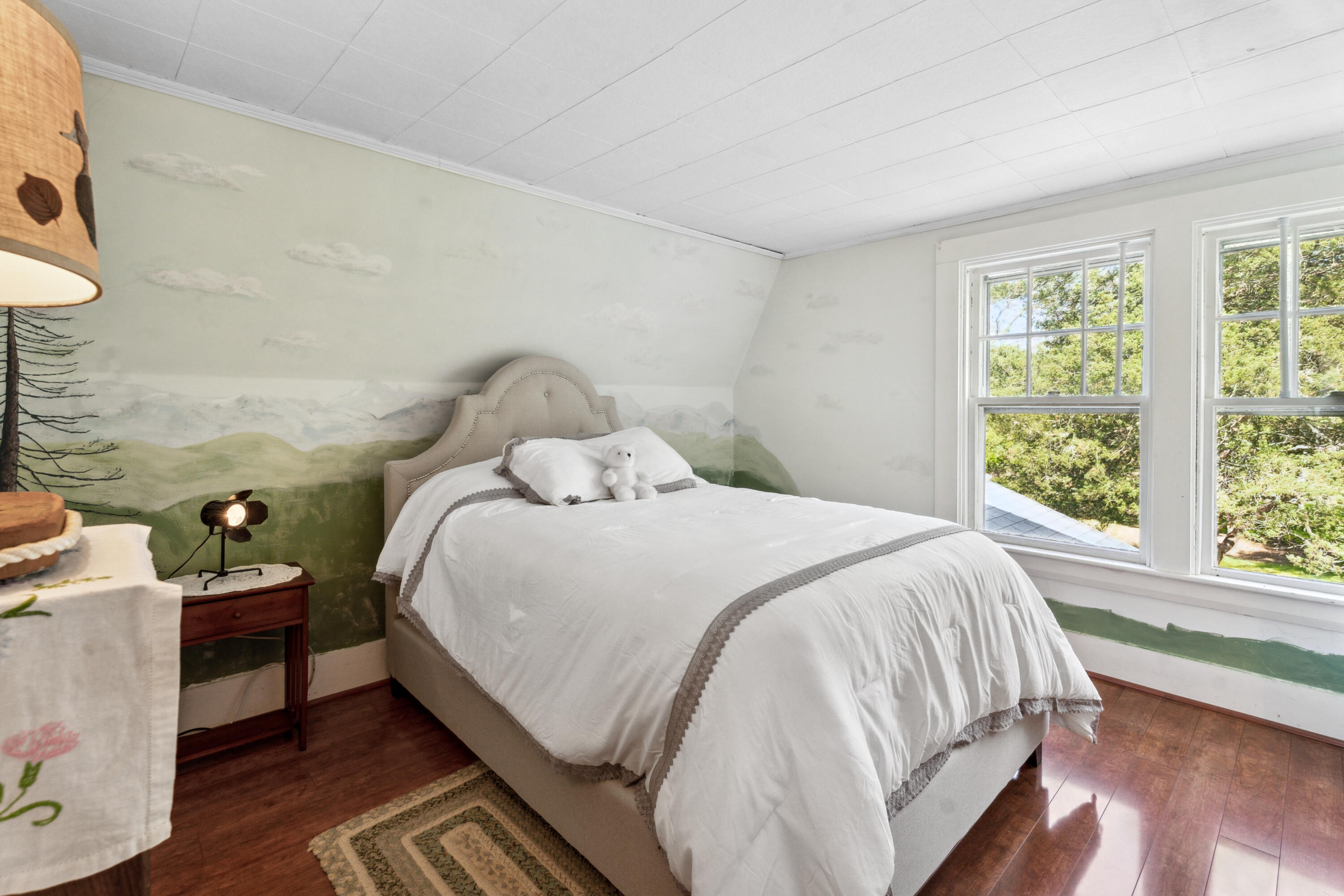 5 Bell Road Bourne, MA 02532 - Photo 16 of 26 a large bed sitting in a bedroom next to a window