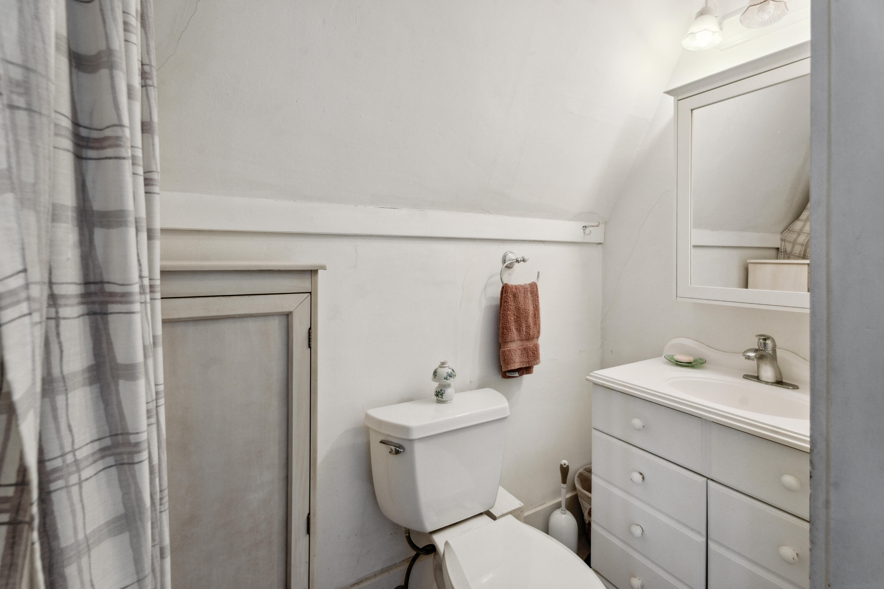 5 Bell Road Bourne, MA 02532 - Photo 17 of 26 a bathroom with a sink toilet vanity and tub