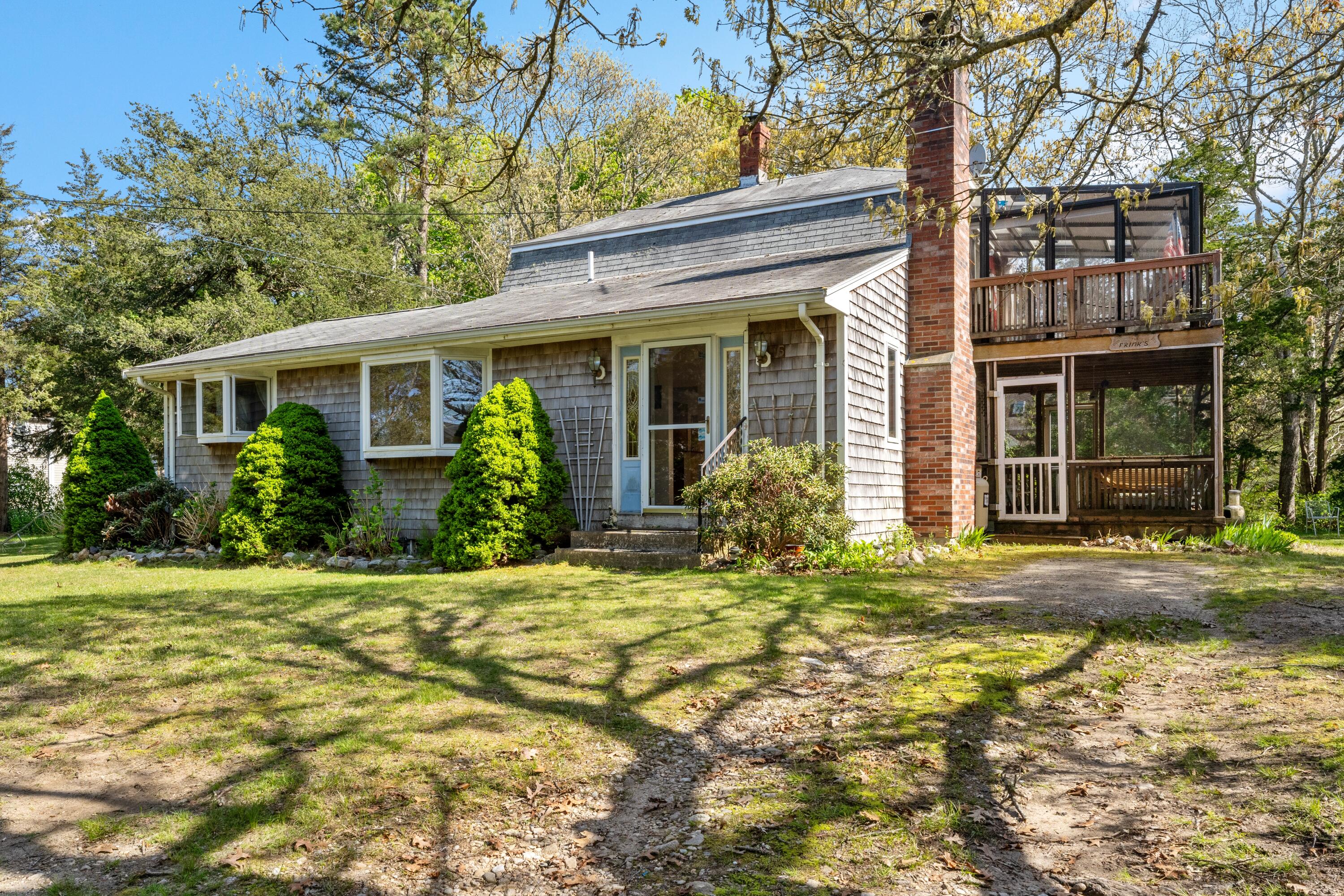 5 Bell Road Bourne, MA 02532 - Photo 18 of 26 front view of a house with a yard
