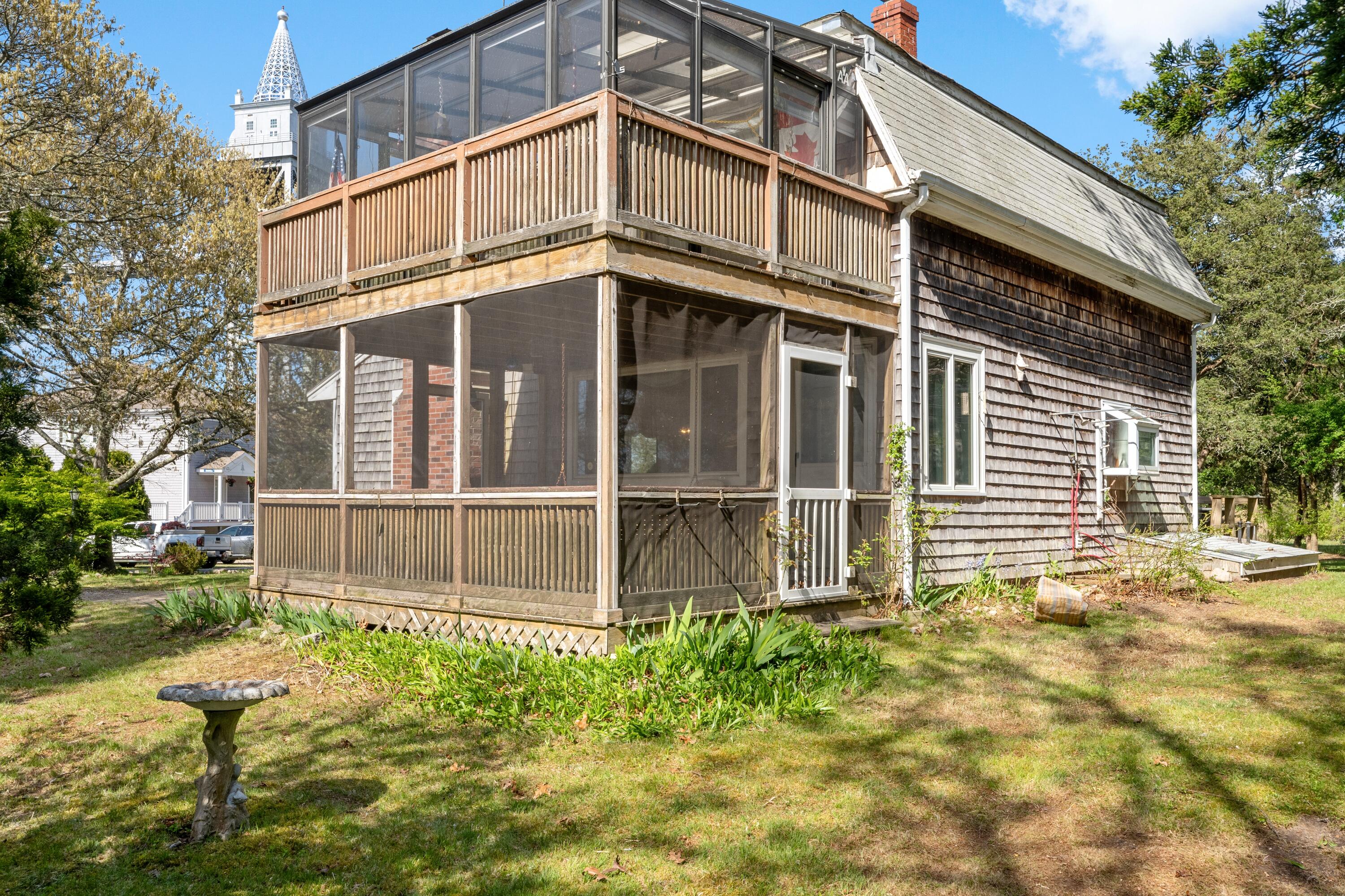 5 Bell Road Bourne, MA 02532 - Photo 19 of 26 a large brick building with a large windows