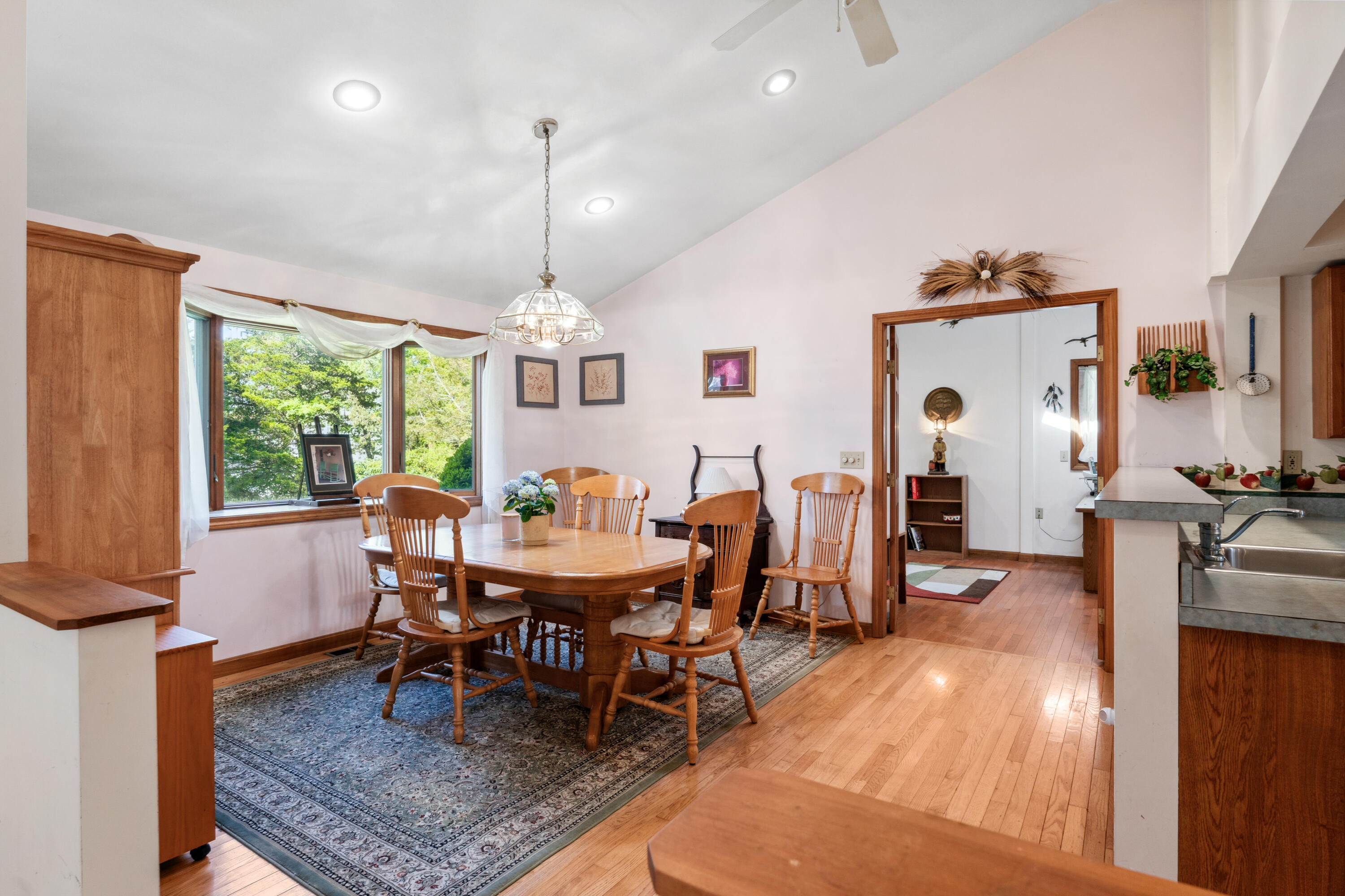 5 Bell Road Bourne, MA 02532 - Photo 5 of 26 a view of a dining room with furniture window and wooden floor