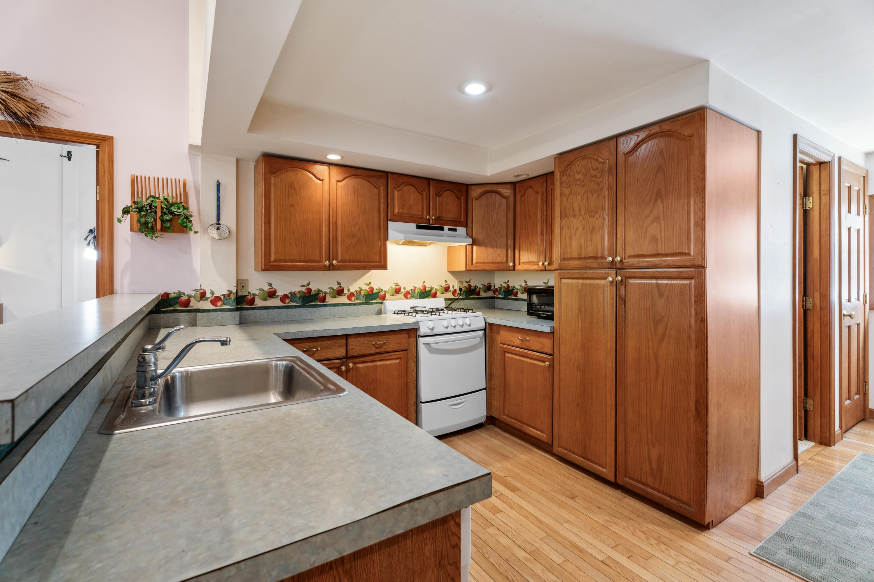 5 Bell Road Bourne, MA 02532 - Photo 10 of 26 a kitchen with a refrigerator sink and stove