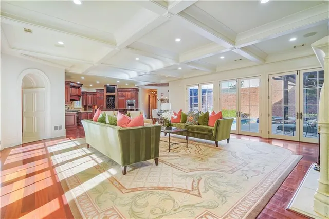 a bathroom with a granite countertop sink a mirror and a shower
