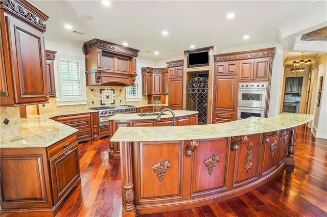 a view of a hallway with wooden floors and stairs
