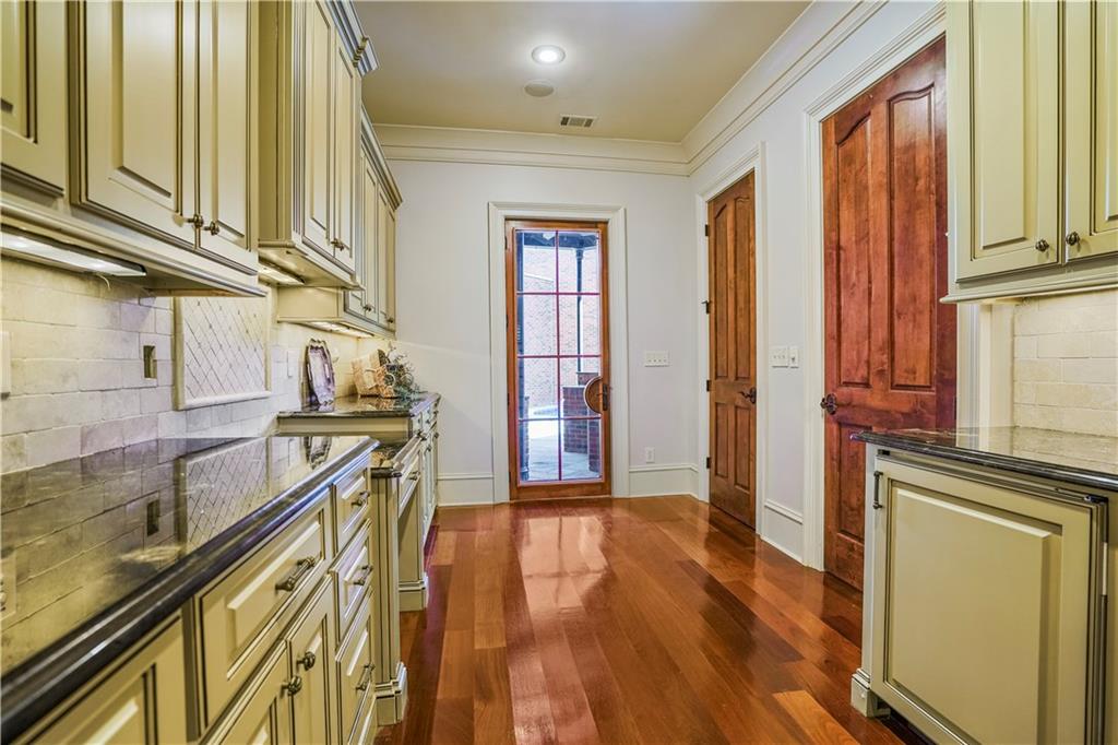 5102 Park Street Covington, GA 30014 - Photo 23 of 97 a view of a hallway with wooden floors and stairs