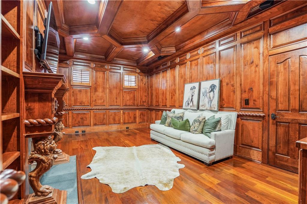 5102 Park Street Covington, GA 30014 - Photo 26 of 97 a living room with furniture a ceiling fan and a rug
