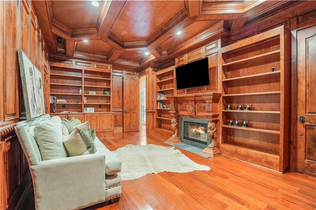 5102 Park Street Covington, GA 30014 - Photo 29 of 97 a living room with furniture and a flat screen tv