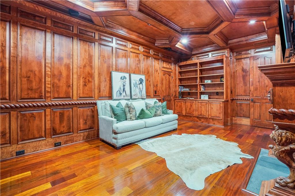 5102 Park Street Covington, GA 30014 - Photo 30 of 97 a living room with furniture a ceiling fan and a rug
