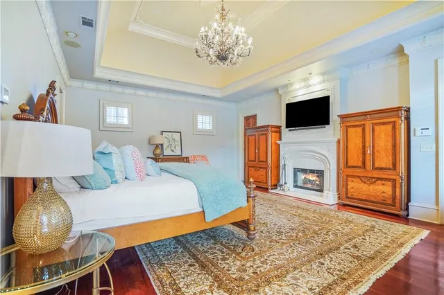 a bedroom with a large bed and a window