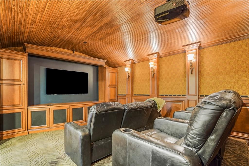 5102 Park Street Covington, GA 30014 - Photo 47 of 97 a living room with furniture and a flat screen tv