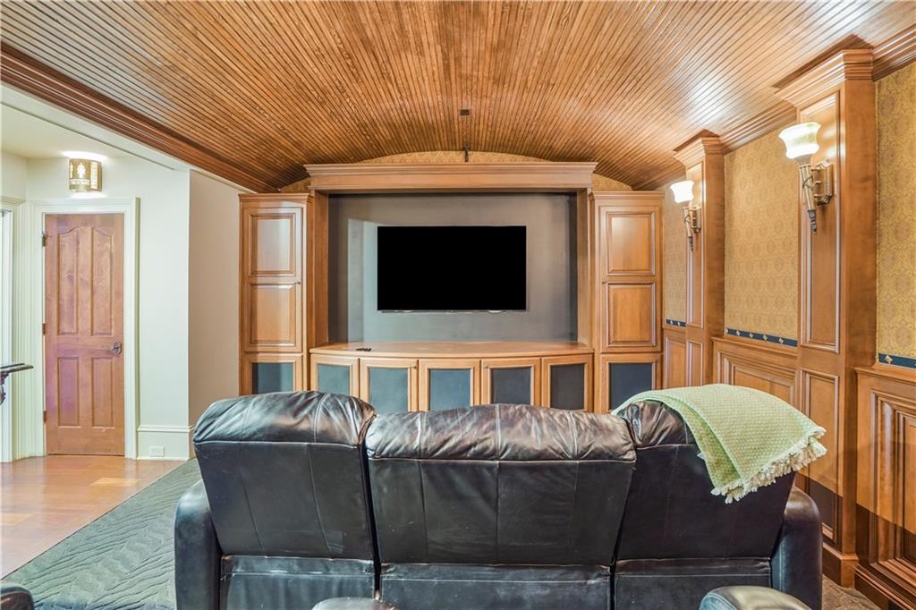 5102 Park Street Covington, GA 30014 - Photo 48 of 97 a living room with a couch and a flat screen tv