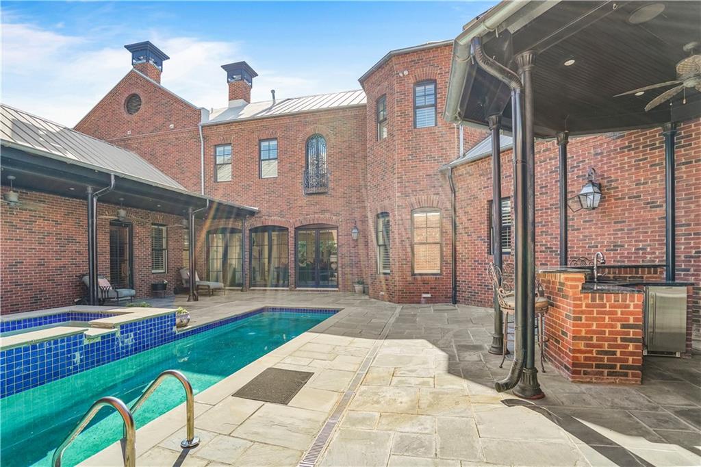 5102 Park Street Covington, GA 30014 - Photo 76 of 97 a front view of a building with garden