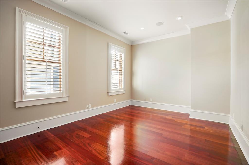 5102 Park Street Covington, GA 30014 - Photo 82 of 97 an empty room with wooden floor and windows