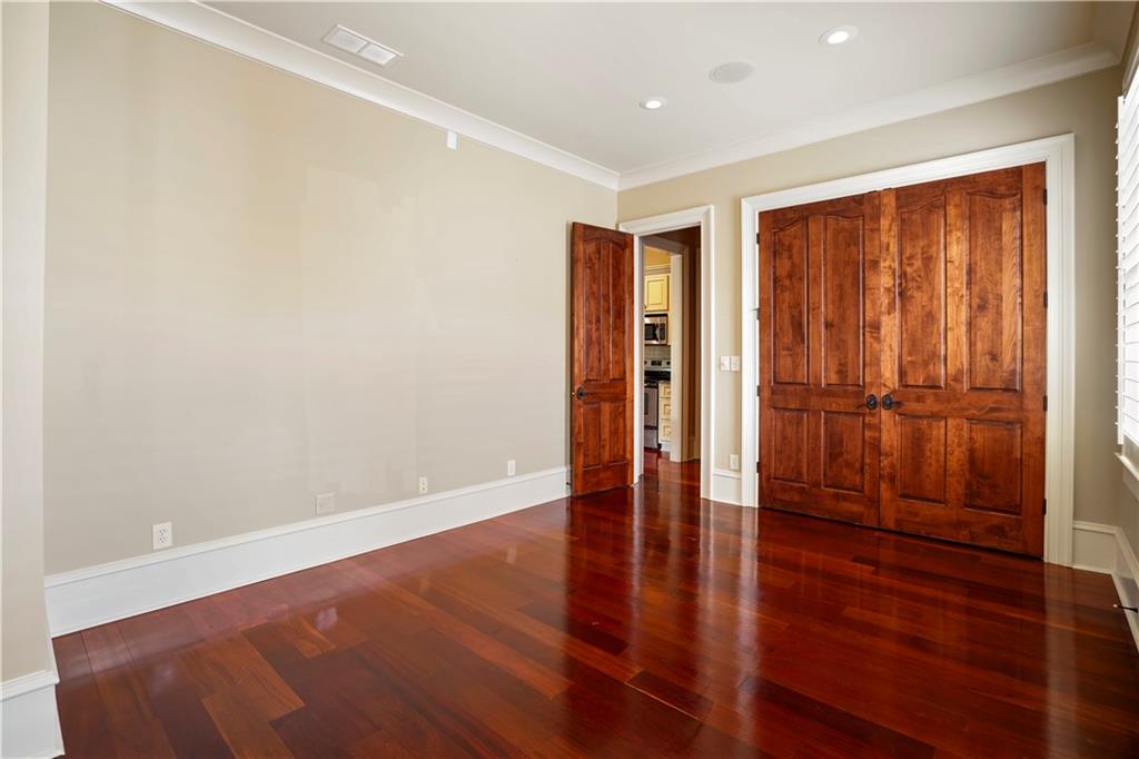 5102 Park Street Covington, GA 30014 - Photo 83 of 97 an empty room with wooden floor and a window