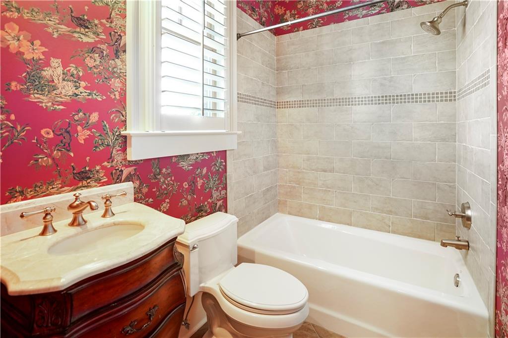 5102 Park Street Covington, GA 30014 - Photo 84 of 97 a bathroom with a sink mirror toilet and bathtub