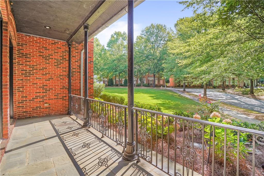 5102 Park Street Covington, GA 30014 - Photo 94 of 97 a view of a porch with wooden floor and fence