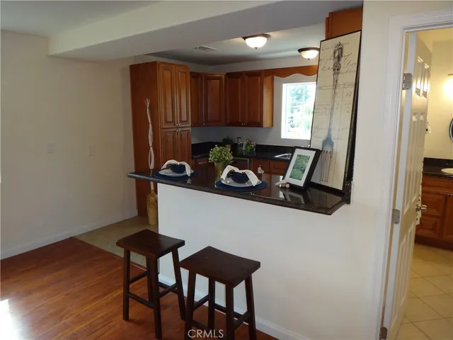 a view of a dining room with furniture and window