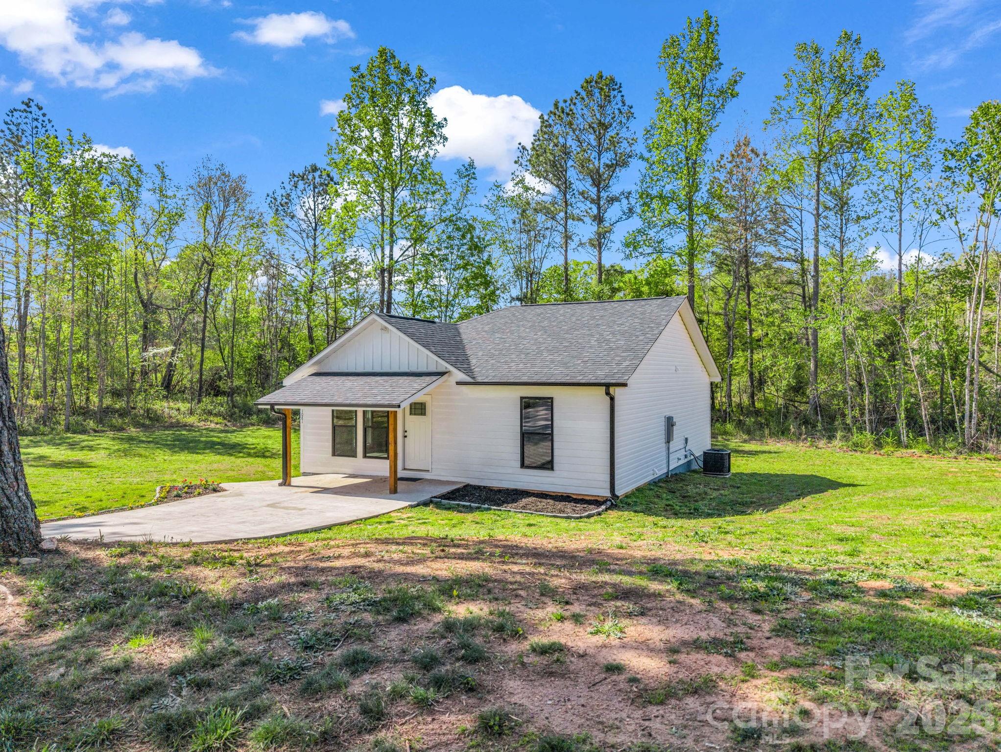 1081 Mt Lebanon Church Road Bostic, NC 28018 - Photo 25 of 47 a view of a house with yard and a garden