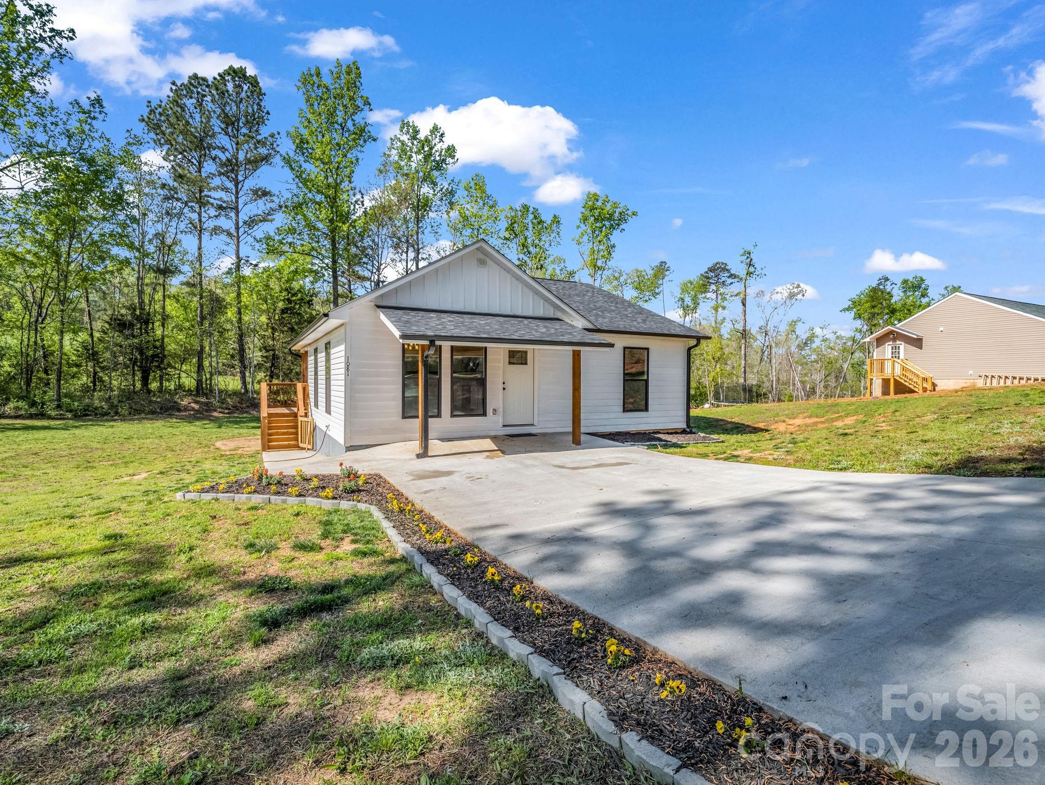 1081 Mt Lebanon Church Road Bostic, NC 28018 - Photo 29 of 47 a front view of a house with a garden