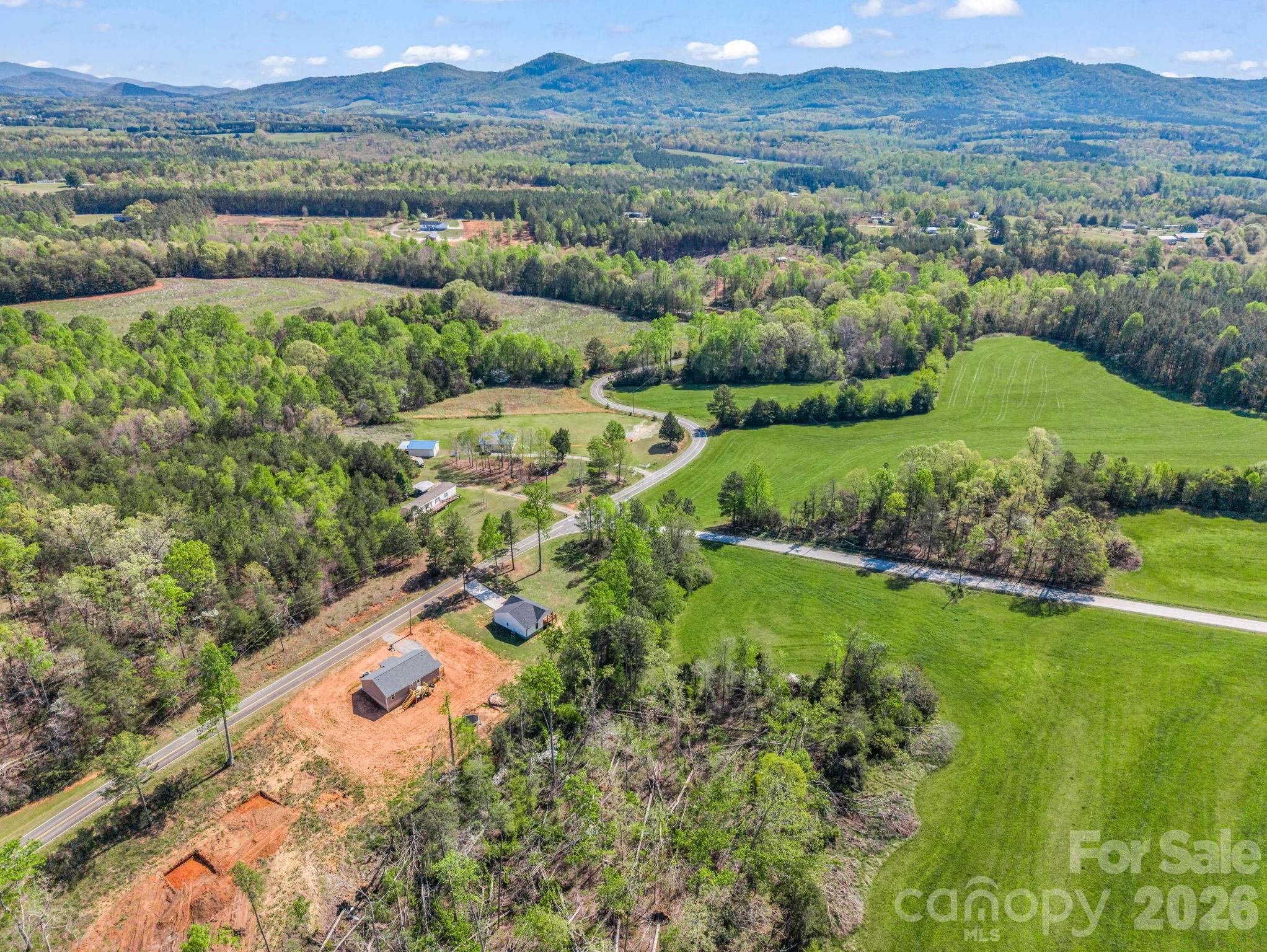 1081 Mt Lebanon Church Road Bostic, NC 28018 - Photo 41 of 47 a view of a lush green hillside and houses