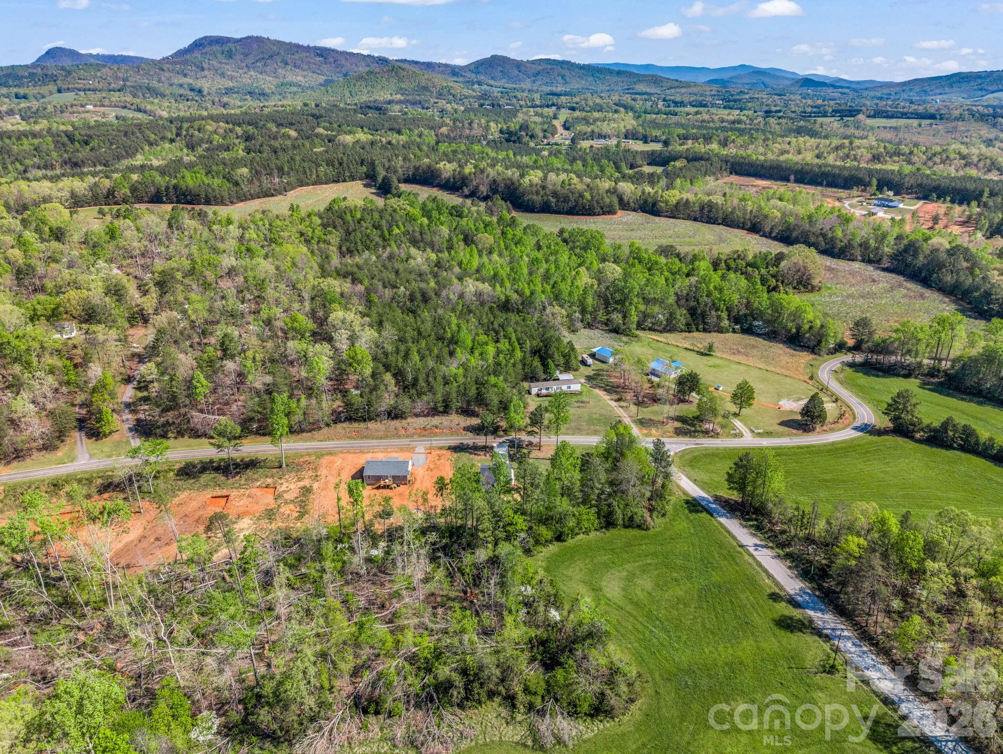 1081 Mt Lebanon Church Road Bostic, NC 28018 - Photo 42 of 47 a view of a lush green hillside and houses