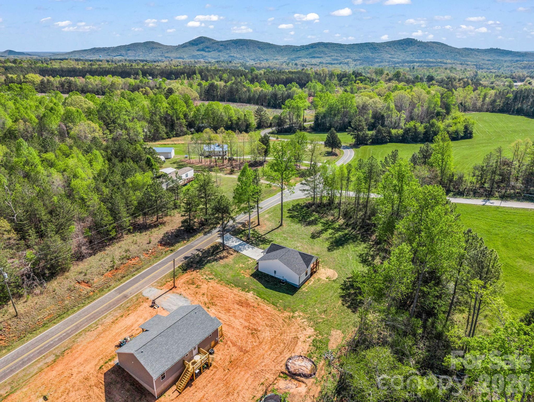 1081 Mt Lebanon Church Road Bostic, NC 28018 - Photo 46 of 47 a view of a city with lush green forest