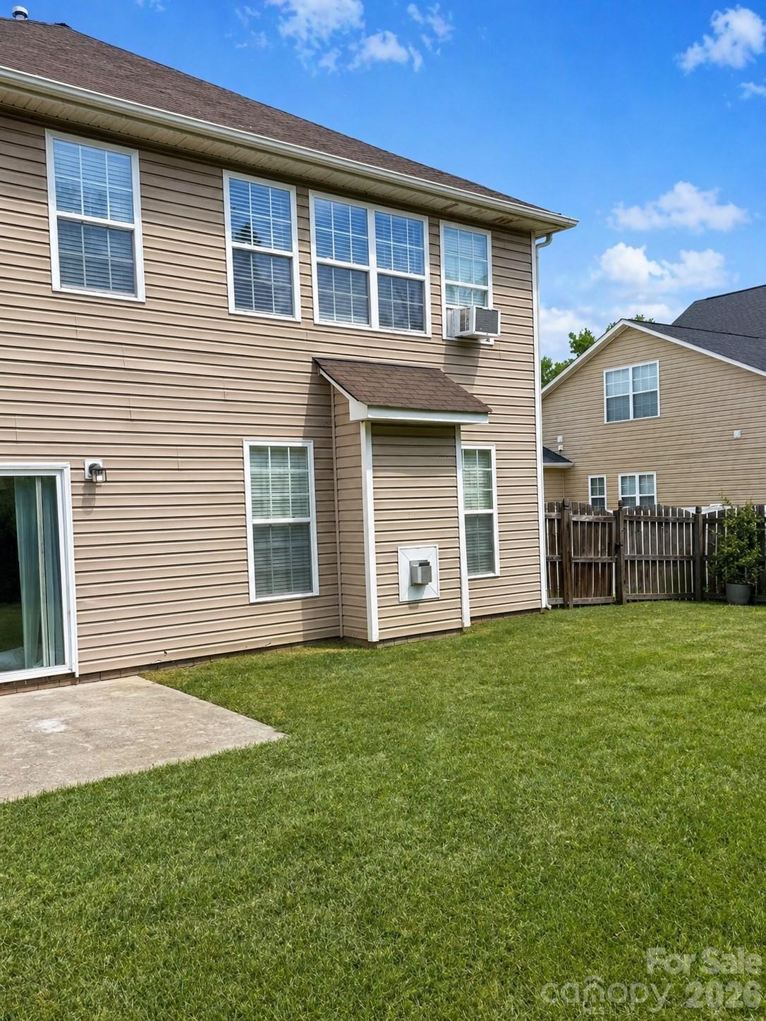 6006 Brook Valley Run Monroe, NC 28110 - Photo 24 of 27 a front view of a house with a garden