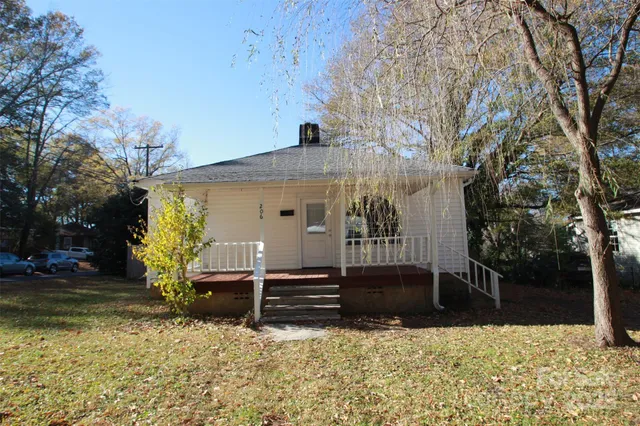 a view of house with yard