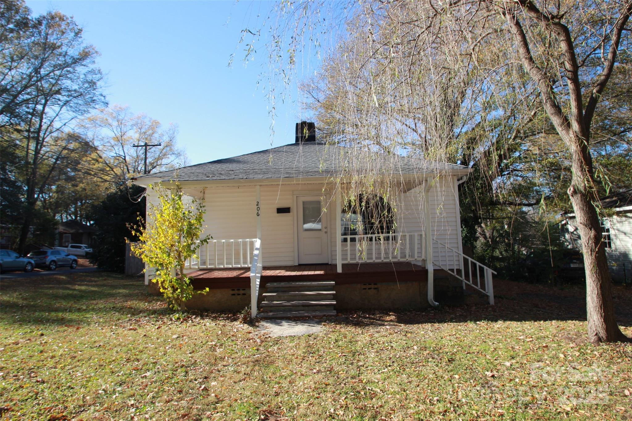 a view of house with yard