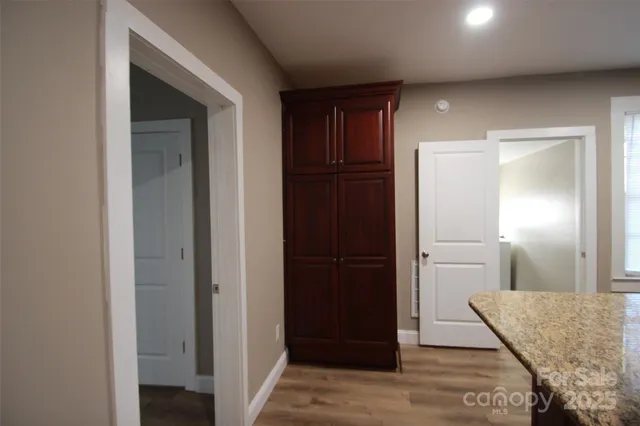 a view of hallway with kitchen