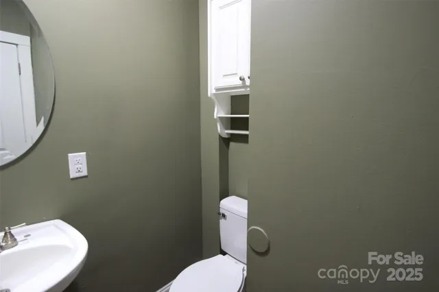 a bathroom with a toilet and a sink