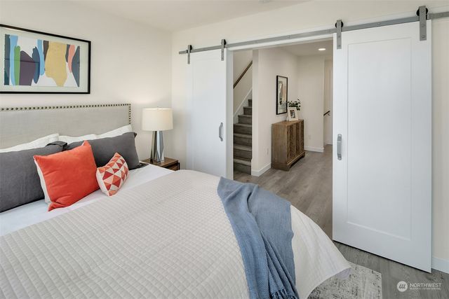 a bedroom with a bed and a walk in closet