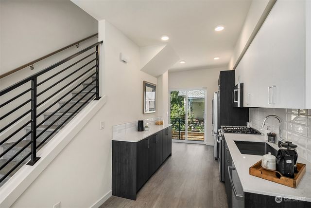a kitchen with counter top space cabinets and a sink