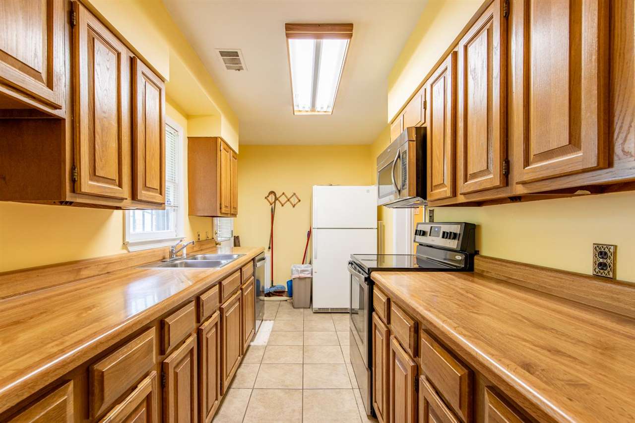 1191 Colonial Road Memphis, TN 38117 - Photo 11 of 24 Lots Of Cabinet Space In These All Oak Cabinets! New Appliances and Fridge Stays!