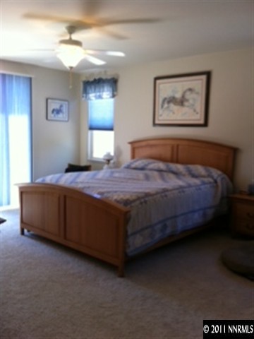 2250 Indian Reno, NV 89521 - Photo 8 of 13 a bedroom with a bed and a chandelier