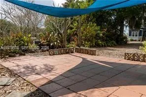 a view of a backyard of the house