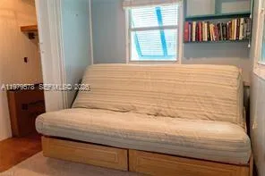 a bathroom with a bathtub and a window
