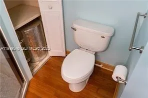 a bathroom with a toilet and a sink