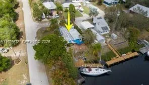 an aerial view of a house with swimming pool and outdoor space