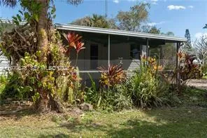 an outdoor view of house with green space