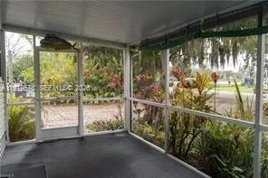 a view of a glass door and deck