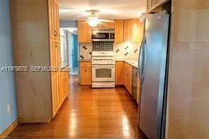 a view of a refrigerator in a kitchen