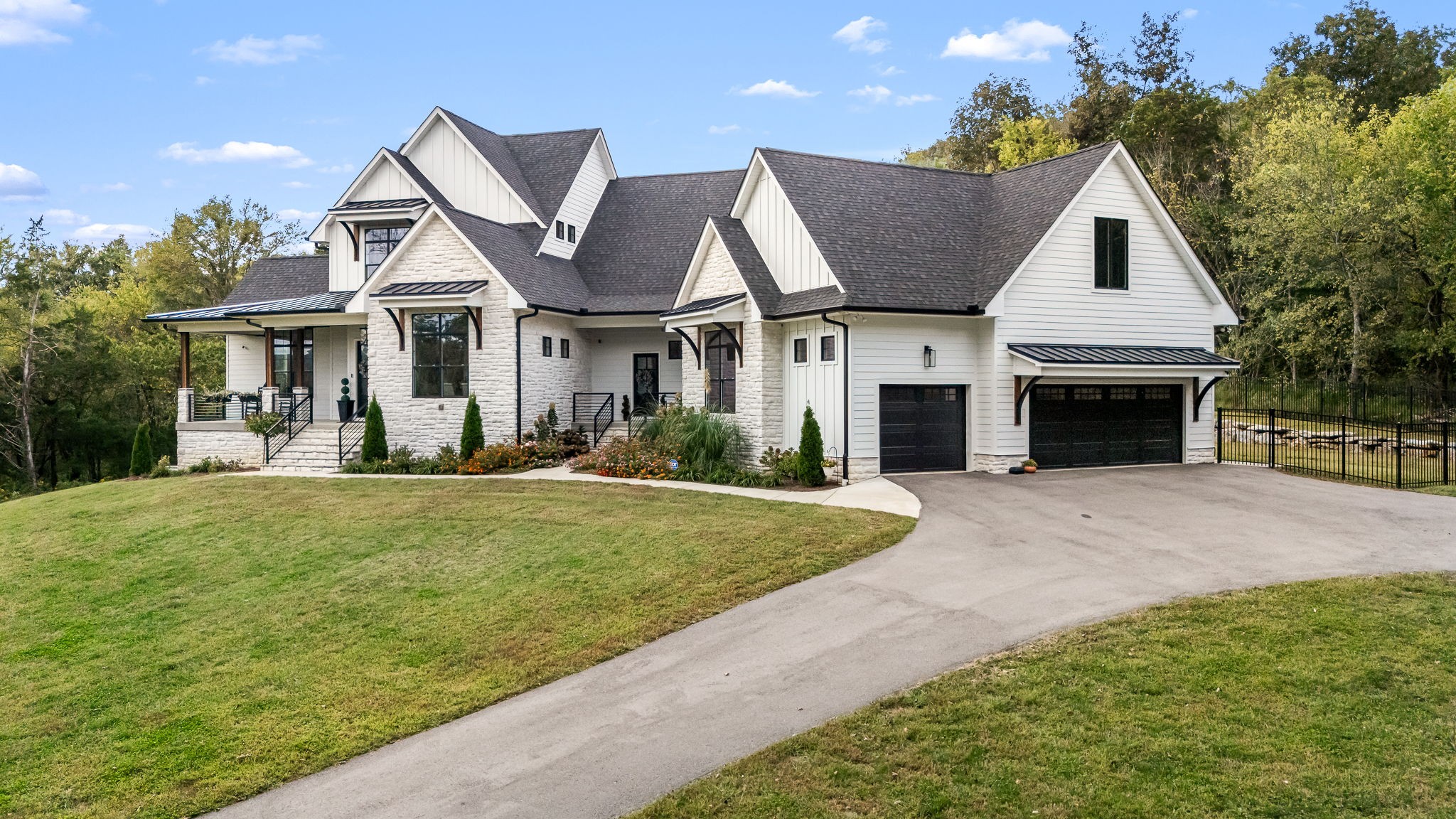 1425 Fuston Hollow Road Auburntown, TN 37016 - Photo 2 of 100 a front view of a house with a yard and garage